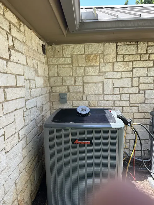 Amana outdoor AC condenser with service gauges attached