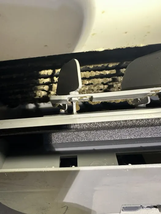 Dirty evaporator coil inside a ductless mini-split head