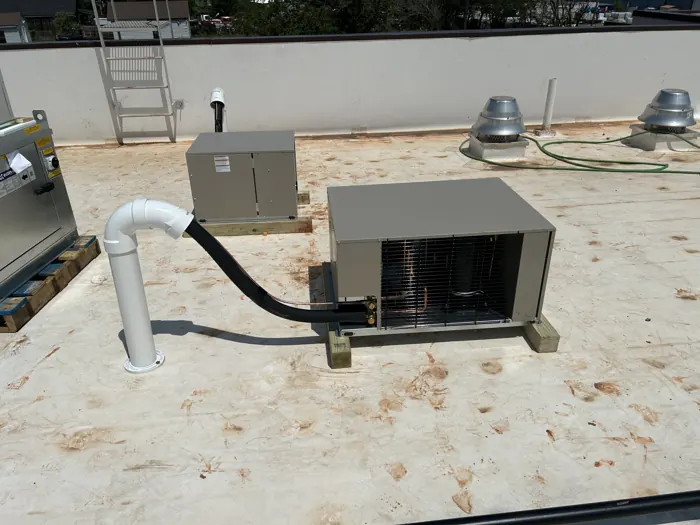 Rooftop condensing units serving a walk-in cooler