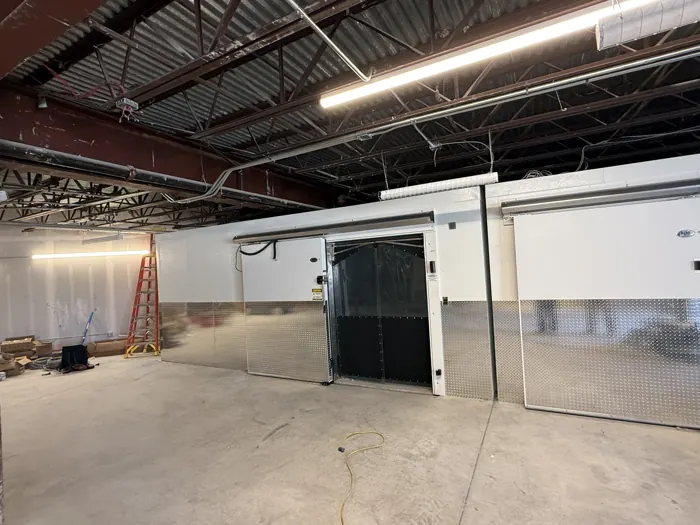 Walk-in freezer and cooler with sliding doors